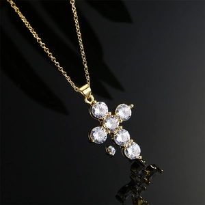 Elegant gold plated necklace featuring a classic cross pendant with micro-inlaid zircons