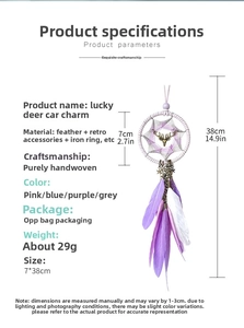 Detail of handmade purple dreamcatcher car pendant with feathers and deer charm ornament