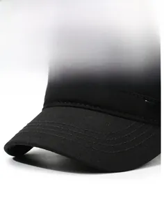 Detail of black cotton flat top hat featuring reinforced visor stitching and eagle emblem