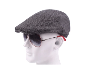 Detailed side view of grey herringbone ivy cap on mannequin with clear fabric texture