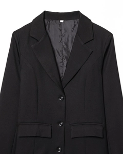 Detail of black slim fit blazer with notched lapels and three-button closure
