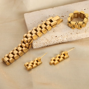 Gold-plated titanium steel jewelry set with watch band link design on beige stone