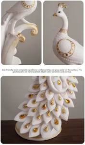 Close-up of white resin peacock statue with gold leaf details and inlaid yellow gemstones
