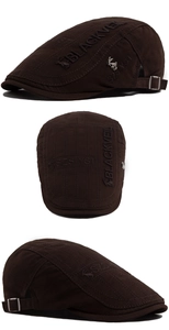 Detail of dark brown cotton duckbill hat with black 3D embroidery and silver rabbit logo