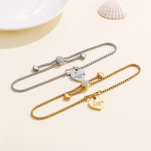 Adjustable stainless steel heart bracelet with Love engraving and cubic zirconia slider