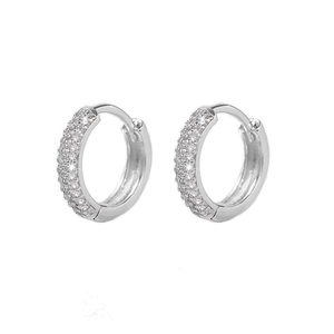 Detailed view of silver hoop earrings featuring densely paved sparkling white zircons