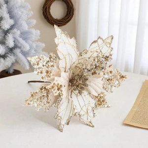Macro detail of 20cm gold sequined Christmas poinsettia flower for luxury tree decoration