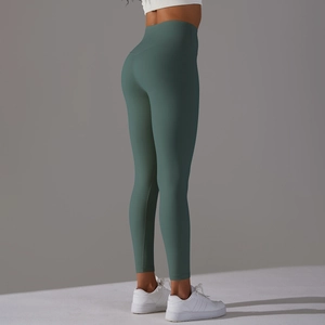 Rear view of high-waisted dark green yoga leggings showing peach butt lifting effect