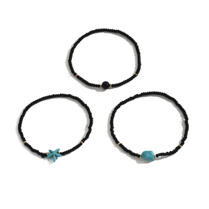 Bohemian 3-piece stretch anklet set with black beads, turquoise starfish, and stone charms