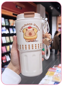 Close-up of white portable Capybara water bottle with brown cap and cute bread illustration