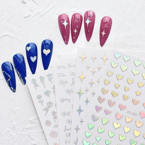 Holographic nail stickers set with laser heart and star designs on white background