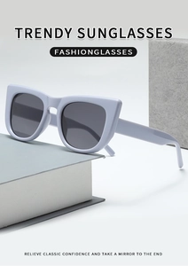 Close-up of light purple cat-eye sunglasses on a modern minimalist display stand