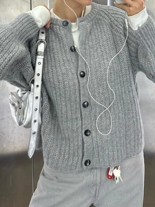 Women's grey knit cardigan with round neck and black buttons for autumn winter style