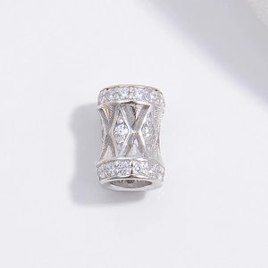 Detailed macro view of S925 silver barrel bead with inlaid zircon and diamond pattern