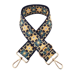 Ethnic bohemian woven bag strap with blue floral pattern and gold metal lobster clasps