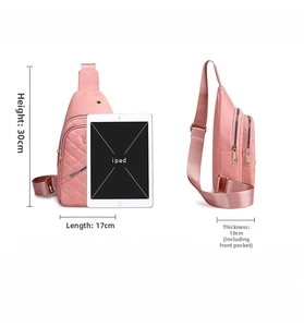Pink nylon chest bag detail showing internal storage capacity with an iPad for scale