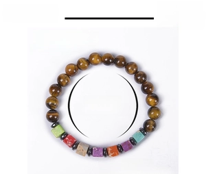 Detail view of tiger eye and chakra stone beads with precise dimension measurements