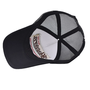 Macro view of breathable mesh and retro 3D embroidery on the black trucker hat