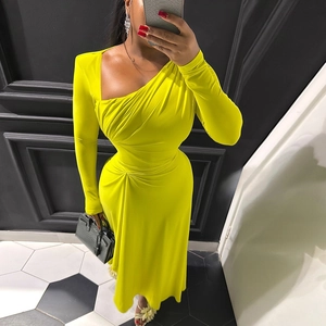 Detail of ruched waist design on fluorescent yellow one-shoulder long-sleeve dress