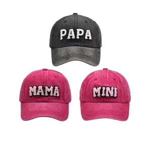 Detail of Papa Mama Mini embroidery on colorful cotton family baseball caps