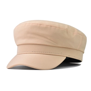 Detail showing the fine stitching and khaki cotton texture of the classic baker boy hat