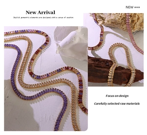 Close-up of vibrant multi-colored square zirconia necklace set with golden finish details