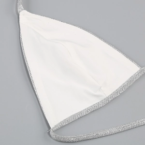 Close-up of silver sequin bikini top showing detailed white lining and sewing texture