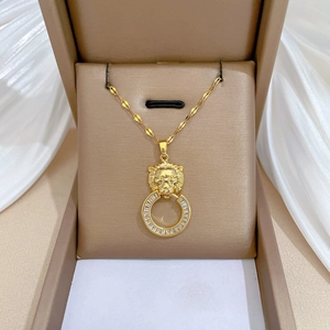 Luxurious gold lion head pendant necklace with zircon crystals and sleek twist chain