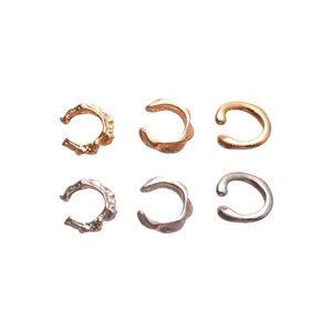 Three-piece set of irregular geometric gold and silver metal ear cuffs in minimalist style