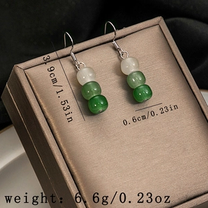 Detail view of retro beaded drop earrings with precise dimensions 3.9cm and 6.6g weight