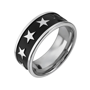 Detail view of vintage titanium steel ring with black enamel and silver star patterns