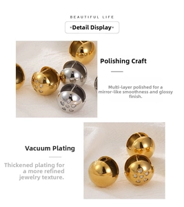 Macro shot of gold and silver ball earrings with heart-shaped inlaid rhinestones