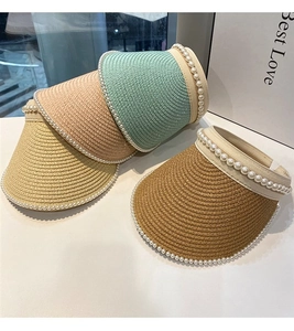 French style pearl-embellished straw sun visors shown in multiple pastel colors