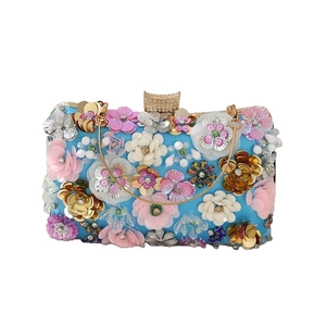 Blue evening clutch bag featuring 3D floral sequins and gold metal chain handle