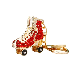Sparkling ice skate keychain with red crystals and gold-plated metal for car keys or bags