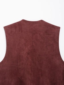 Close-up of the burgundy faux suede fabric on the back neckline of the embroidered vest
