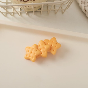 Detailed view of creative star-shaped biscuit hair clip with realistic matte food texture