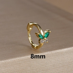 Macro view of 8mm gold butterfly earring featuring green and white zircon inlay details