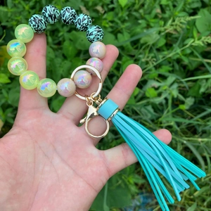 Luminous beads and turquoise leopard print bracelet keychain with a stylish leather tassel
