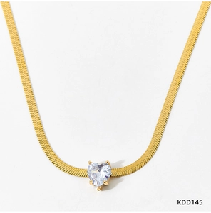 Detail of gold snake chain necklace featuring a claw-set heart-shaped zircon pendant