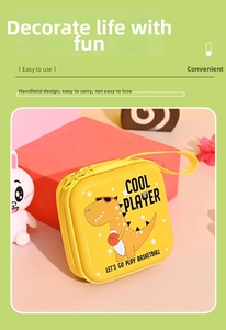 Detail of yellow dinosaur tinplate purse with zipper and Cool Player basketball graphics