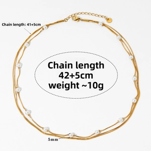 Detailed view of triple-layered pearl and snake chain with adjustable lobster clasp
