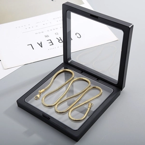 Black 3D floating jewelry display box with clear PET film and gold snake chain