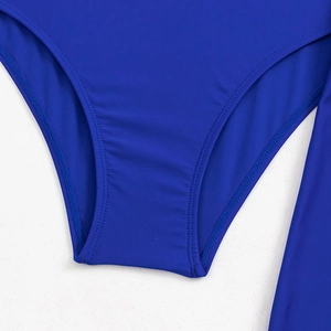 Close-up of royal blue swimsuit fabric with precise double-needle stitching and smooth seams