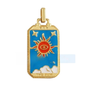 Detailed view of copper tarot card pendant with gold plating and colorful enamel sun art