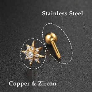 Macro shot of gold star labret stud with zircon detail and stainless steel screw ball
