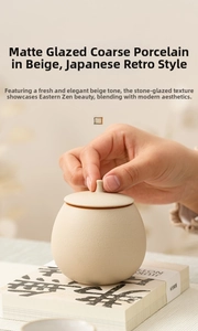 Detailed close-up of a hand opening the lid of a beige stoneware ceramic tea canister
