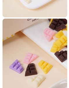 Macro detail of colorful resin mini chocolate charms for DIY crafts and phone case decor
