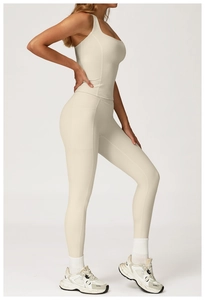 Detailed side view of cream yoga set showing high waist leggings with side pocket