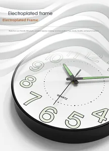 Close-up of modern 14 inch wall clock with ABS plastic frame and quartz movement